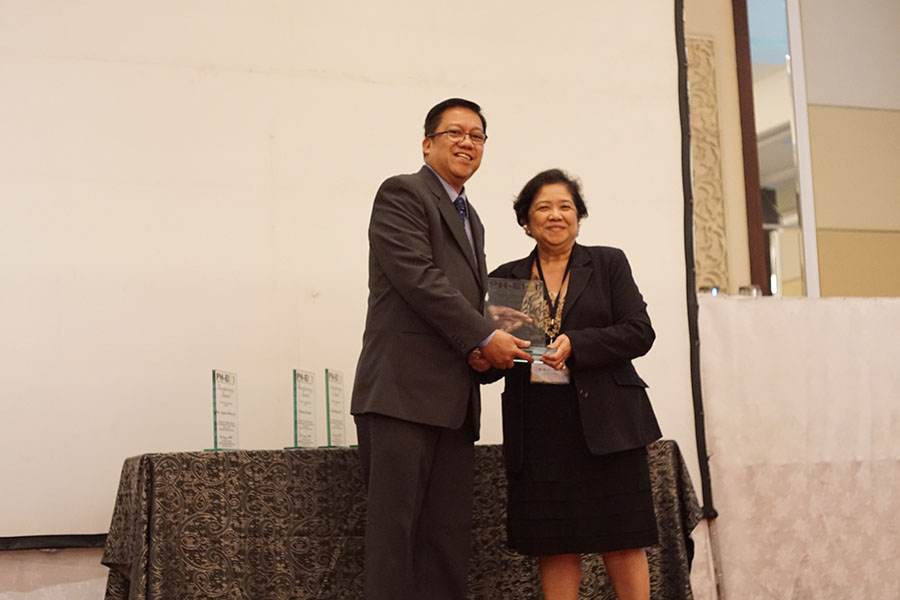 Engr. Juancho Pablo S. Calvez receiving the citation from Ms. Nelia C. Halcon