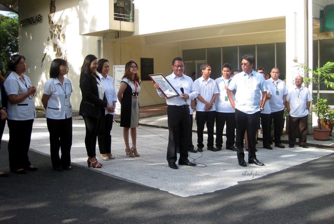 Engr. R. L. Velasco receiving the ISO 9001:2008 Certificate